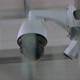 Black Surveillance Video Camera Turning to the Right