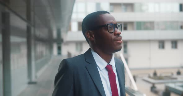 Confident Young Afroamerican Businessman Standing Outside Office Building alt