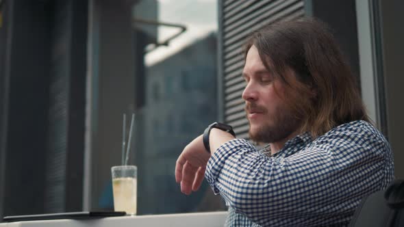 Man with Smartwatch Using Voice Recorder Recognition Audio Message Command Outside on Street alt