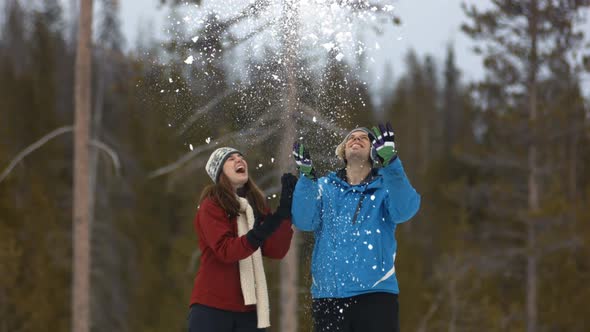 Couple in living room watching television together alt