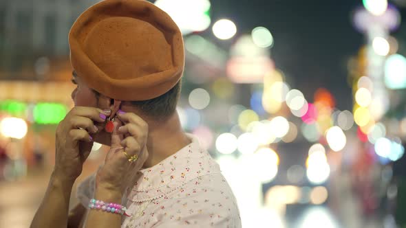 4K Confidence Asian lgbtq guy wearing woman clothes walking down city street at night alt