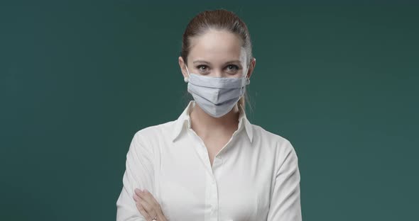 Young woman wearing a reusable cloth face mask, coronavirus covid-19 prevention