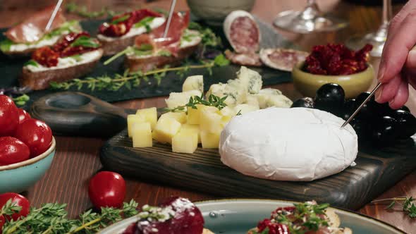 Chef Cuts Camembert Italian Cheese Spanish Brie in Traditional Restaurant Tasty Holiday Table Wine alt