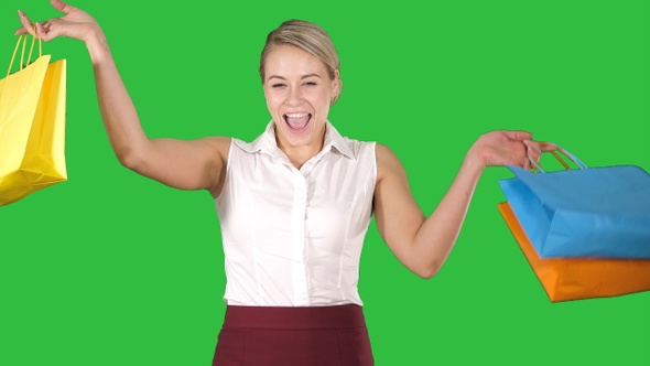 Image of a lovely shopping lady holding her purchases on alt