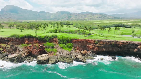 Scenic Aerial Panorama of Waterfront Golf Club and Course on Kauai Island Hawaii alt