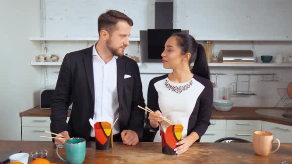 Co-workers Have Meal Together in the Office Kitchen alt