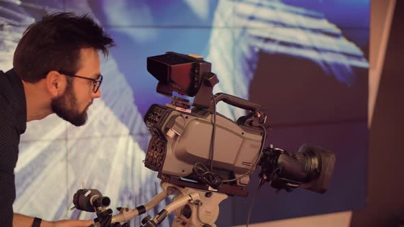 Making TV Show Or Film. Cameraman Working In TV Studio Video Production Filming Interview. alt