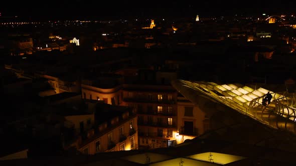Magical nighttime illumination on the Setas de Sevilla. Aurora Experience and the skyline of Sevilla alt
