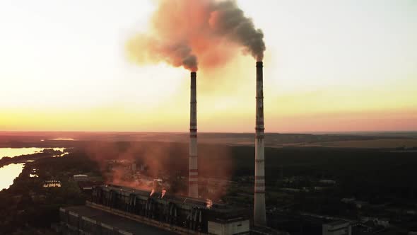 Aerial drone view of high smoke stack alt