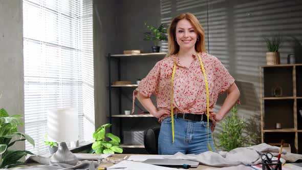 Portrait of Attractive Happy Female Creative Clothing Designer Standing in Modern Office alt