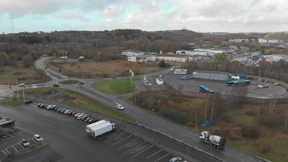 Traffic in Industrial Area Roads and Roundabout Rising Aerial alt
