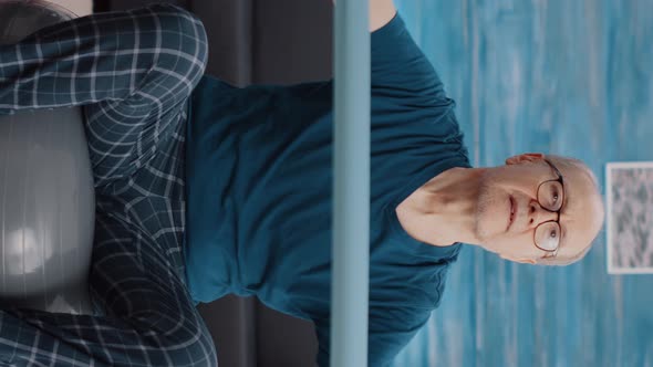 Vertical Video Pensioner on Toning Ball Training with Resistance Band alt