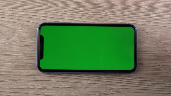 Smartphone with Green Screen Mockup Swipe Hand Close Up Mobile Phone User