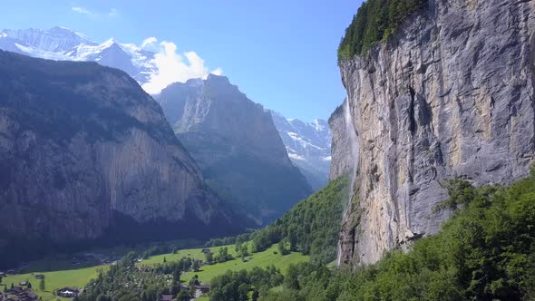Aerial travel drone view of the Lauterbrunnen Valley and Staubbach Falls, Switzerland. alt