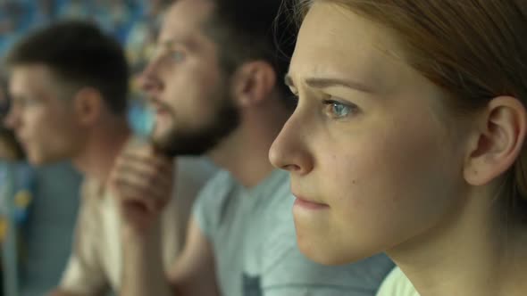 Girl Fan With Friends Watching Sport Game or Races at Stadium, Worried, Anxious alt