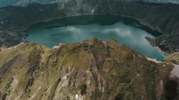 Ecuadorian Andes Volcano And Blue Lagoon Of Quilotoa In Ecuador. Aerial Tilt-up Shot alt
