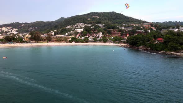Aerial View Of Parasailer Over Kata Beach In Phuket. Dolly Forward alt