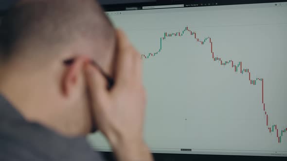 A Trader in Depression Due to a Fall in the Stock Market or Crypto Currency alt