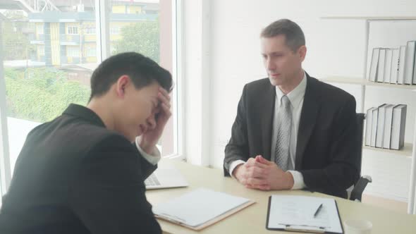 Young asian business man with applicant job interview having stress and sad at the office. alt