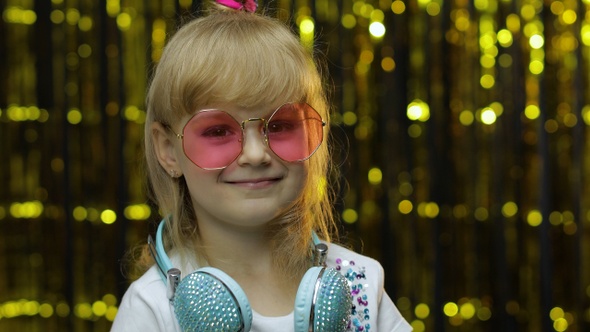 Child Dances, Listens Music on Headphones. Little Kid Girl Dancing, Having Hun, Relaxing, Enjoying alt