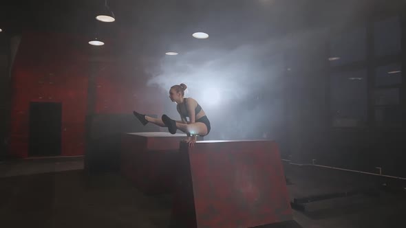 Female Gymnast Performs Handstand on the Training Ground for Parkour and Workout Dark Space Slow alt