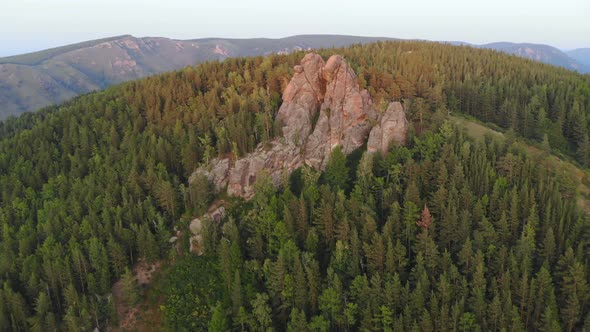 Aerial View of Rocks and Forest Nature Reserve Pillars at Sunset