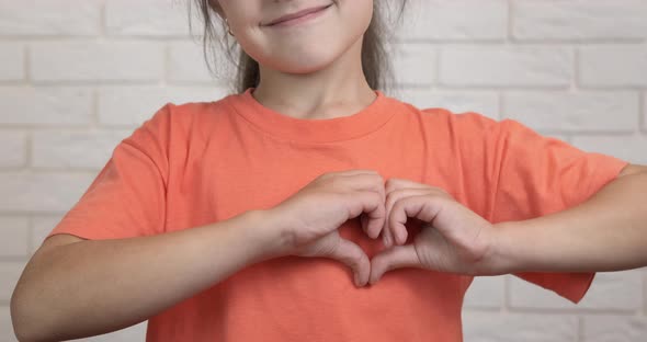 Shows a Heart with Hands alt