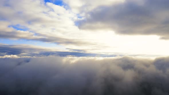 Flight through the moving cloudscape. Texture of clouds. Panoramic view. Clouds in motion	