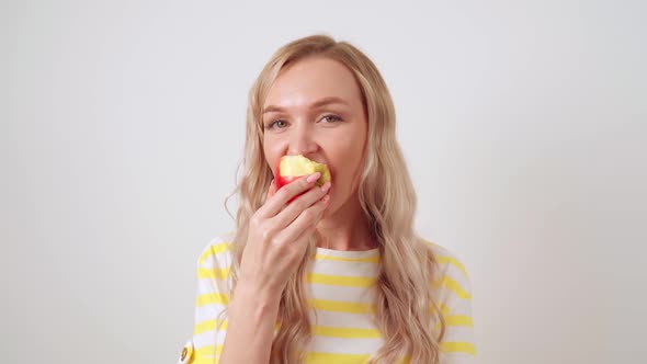 Young Blonde Woman Relaxes on a Comfortable Sofa in Headphones the Girl Enjoys Listening to Music alt