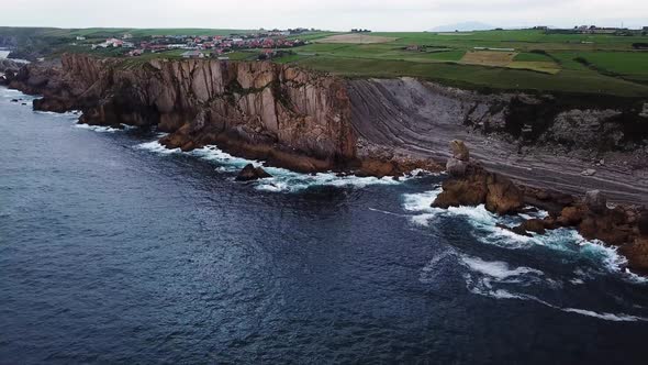 Aerial View of Reefs and Cliffs During Sunset at Arnia Beach. Northern Spain in Summer