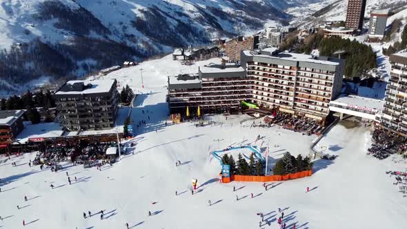 Majestic Winter Aerial Landscape and Ski Resort with Typical Alpine Wooden Houses in French Alps