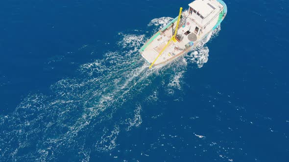 A Small Fishing Boat Goes To the Open Sea To Search for and Catch Salmon.