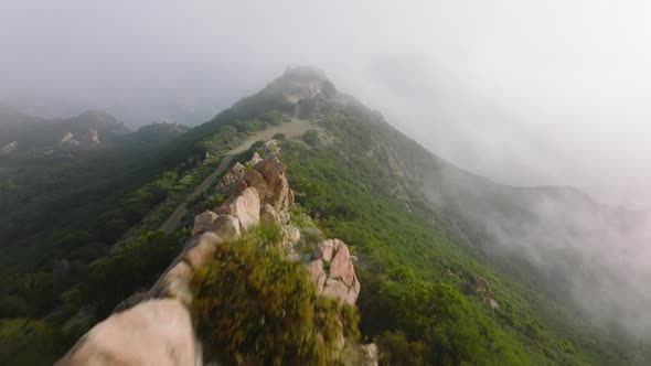 Bright White Cloud Above Scenic Rocks on Green Peak  Outdoor Nature Background alt