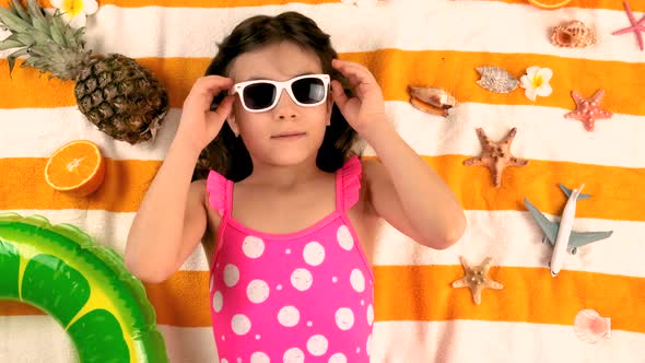 Children Sisters Sunbathe on the Beach alt