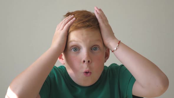 Adorable Handsome Child Looks Into Camera with Delight and Surprise at Face alt