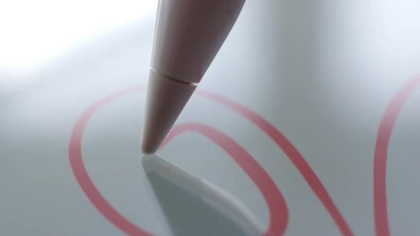 Macro Follow Shot of an Artist Hand Drawing on a Digital Tablet with Pencil. Pencil Is Connected To alt