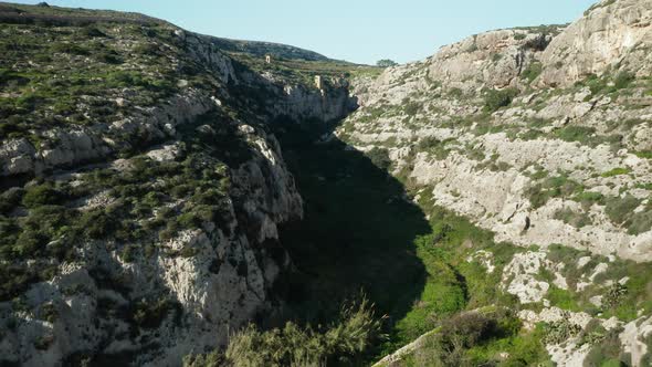 AERIAL: Flying Over Canyon Near Magrr Ix-Xini Bay on Gozo Island in Malta