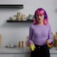 Carefree Elegant Pink Haired Female in Headphones Singing and Dancing in Kitchen - VideoHive Item for Sale