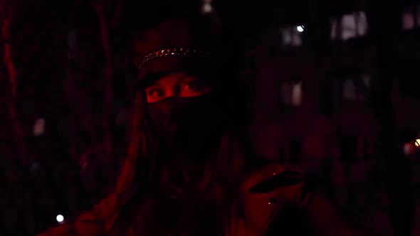 Girl in Black Virus Mask at Night in Red Light Stylish Street Image alt