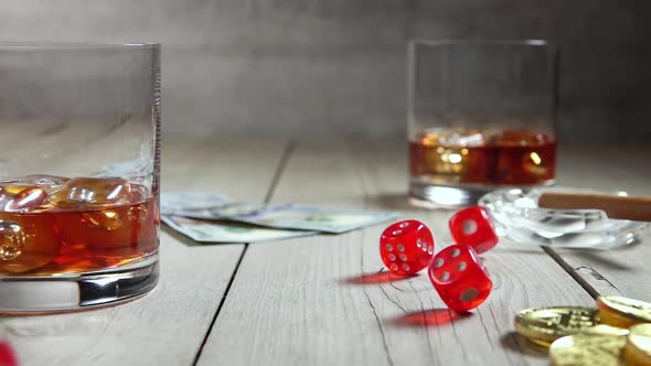 Whiskey in Highballs on a Wooden Table and Dice