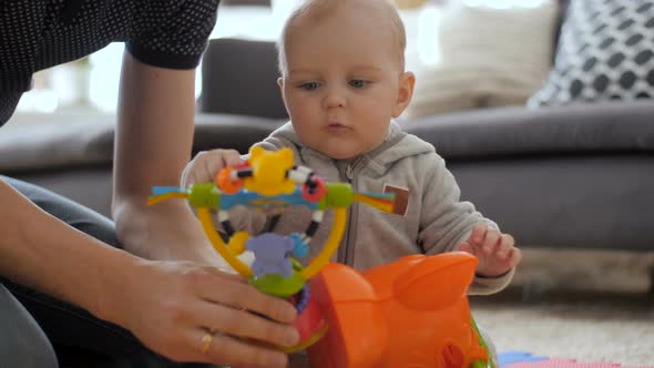 Baby Boy Playing With Colourful Toy