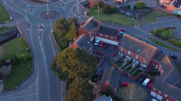 Golden hour aerial view over a roundabout in Exeter, UK. alt