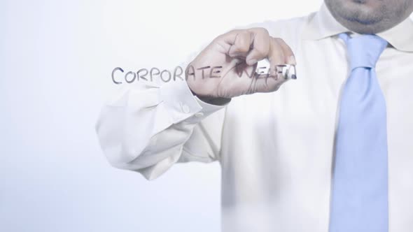 Asian Businessman Writes Corporate Welfare