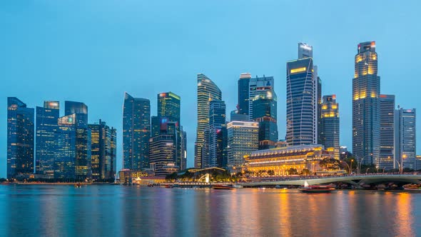Stunning Twilight View of Singapore City Cityscape Skyscrapers Day To Night Timelapse alt
