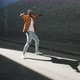 Slow Motion Portrait of Happy African American Guy Moving Outdoors Dancing and Smiling