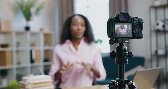 African American Woman Recording Video for Her Internet Followers from Cozy Home Studio alt