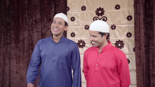 2 Muslim men laughing alt