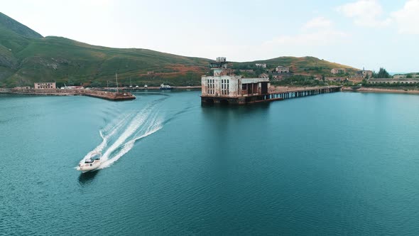 Summer landscape with a coastal city alt