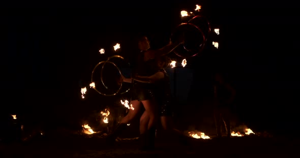 Slow Motion Professional Fire Performance Three Women with Torches and a Man with Flamethrowers alt