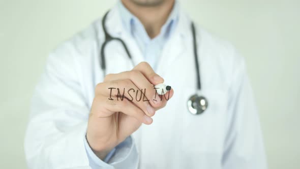 Insulin, Doctor Writing on Transparent Screen alt